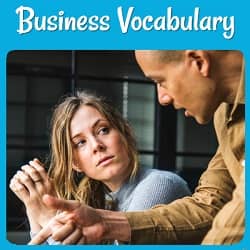 Business Vocabulary. Photo of a young man and woman possibly discussing business plans.