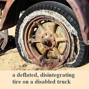 example of negative prefixes from the prefix list: a deflated, disintegrating tire on a disabled truck